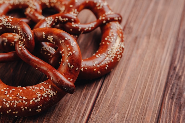 Fresh pretzel sprinkled with sesame seeds