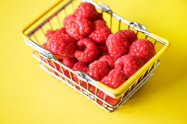 Fresh raspberries in a mini basket