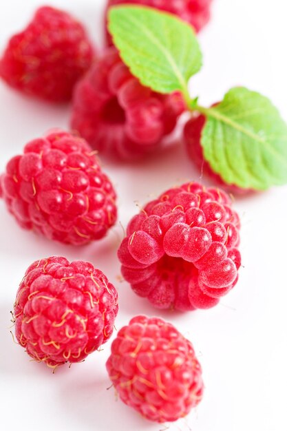 Fresh raspberries on white background