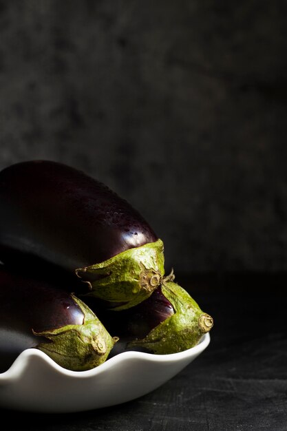 Fresh raw eggplants arrangement