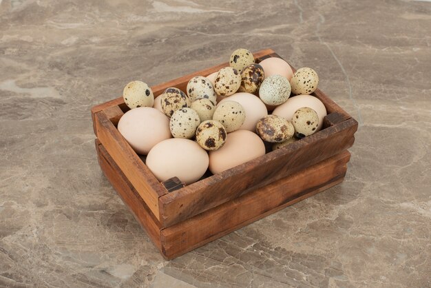 Free photo fresh, raw, farm quail eggs on marble surface