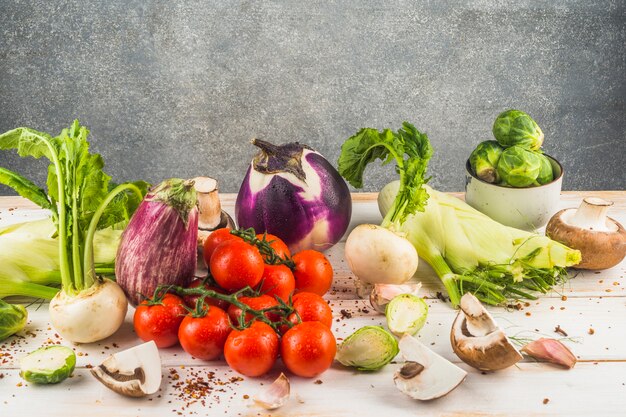 Fresh raw vegetables on wooden table