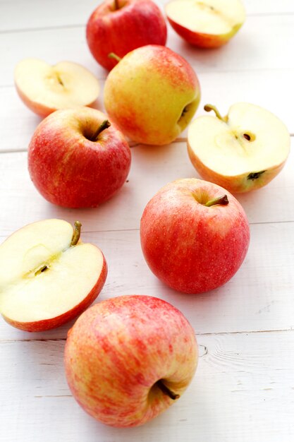 Fresh red apples on a wooden table