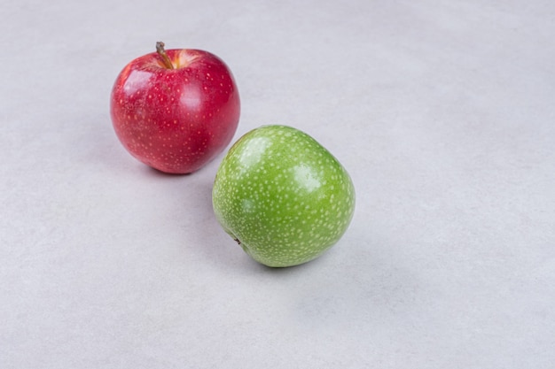 Free photo fresh red and green apples on white background.