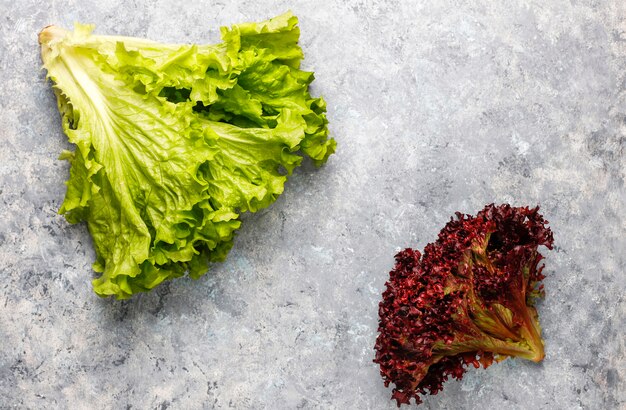 Fresh red lettuce on grey concrete table, top view