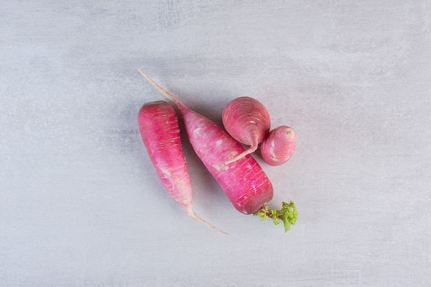 Fresh red radishes on marble background. High quality photo