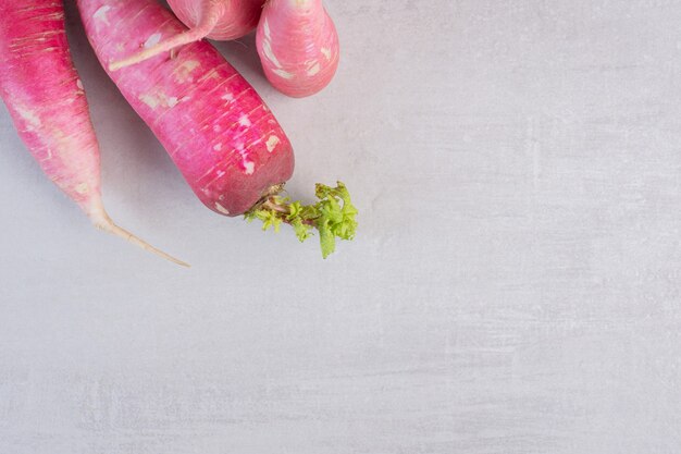 Fresh red radishes on marble background. High quality photo