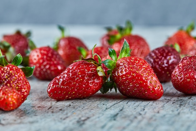 Fresh red strawberries on marble surface