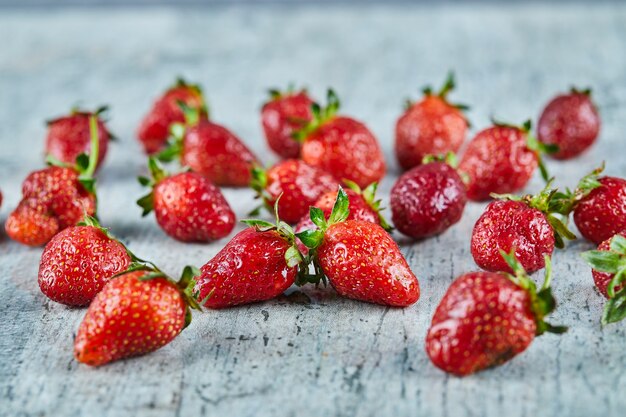 Fresh red strawberries on marble surface