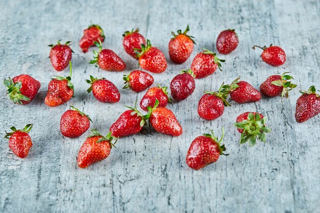 Fresh red strawberries on marble surface