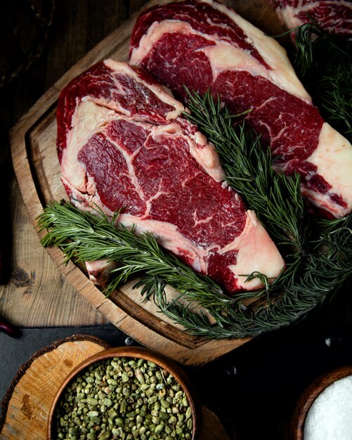 Fresh rib eye steaks on the table