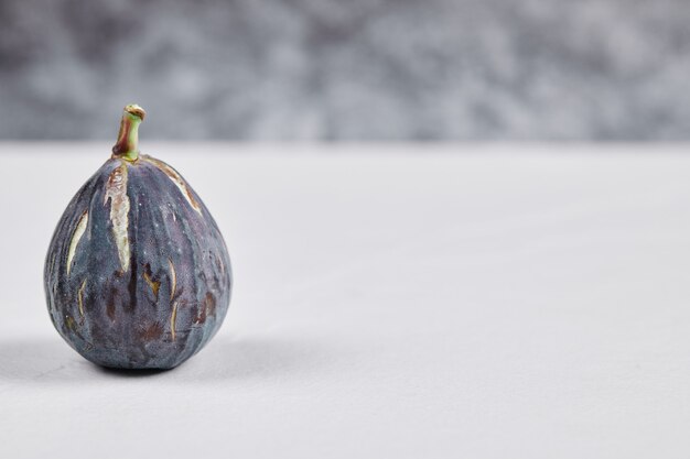 Fresh ripe fig on white.