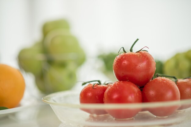 fresh ripe tomatoes on table