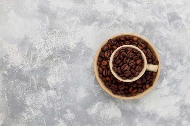 Fresh roasted coffee beans on concrete ,top view,flat lay