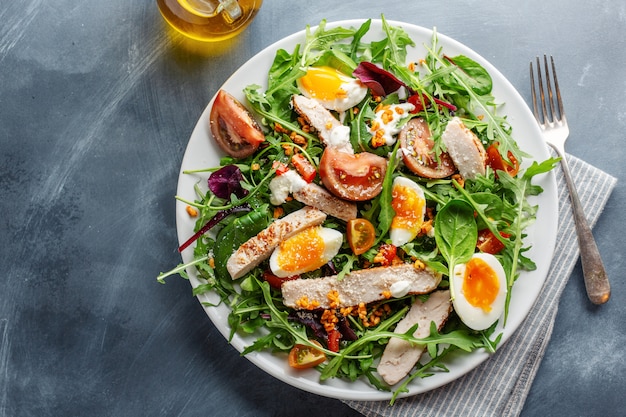 Fresh salad with turkey, eggs and vegetables