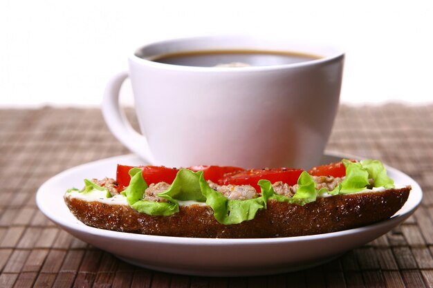 Fresh sandwich with fresh vegetables and coffee