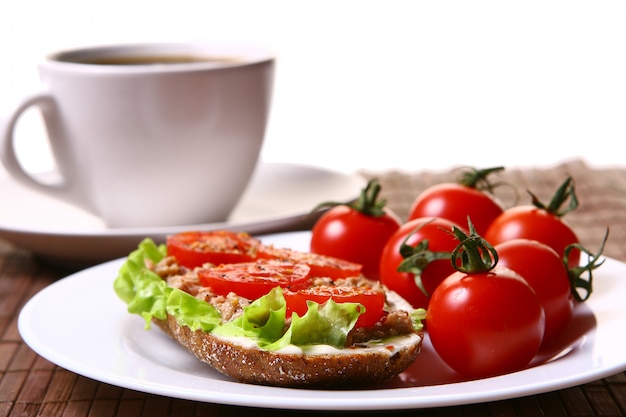 Fresh sandwich with fresh vegetables and coffee