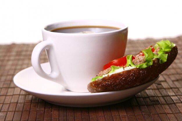 Fresh sandwich with fresh vegetables and coffee