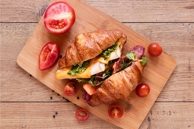 Fresh sandwiches arrangement on wooden background