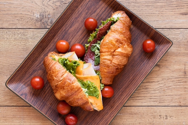 Fresh sandwiches assortment on wooden background