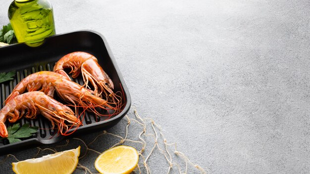 Fresh shrimps in pan with condiments