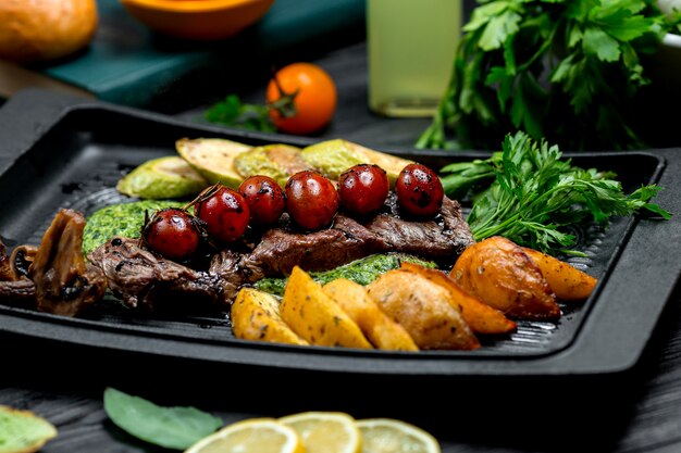 Fresh steak with fried potatoes and vegetables