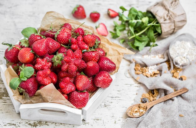 Fresh strawberries on a wooden tray