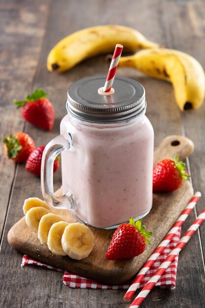 Fresh strawberry and banana smoothie in jar