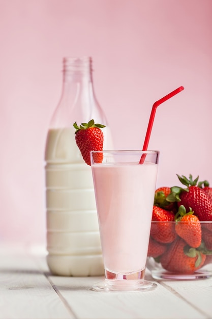 Fresh strawberry milk shake on wood