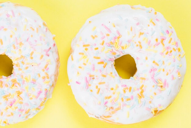Fresh sugar donuts with colorful sprinkles