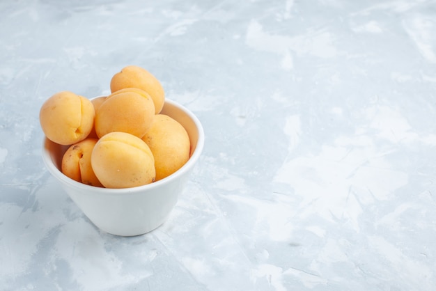 fresh sweet apricots mellow and yummy fruits inside plate on white desk, fruit fresh summer meal vitamine