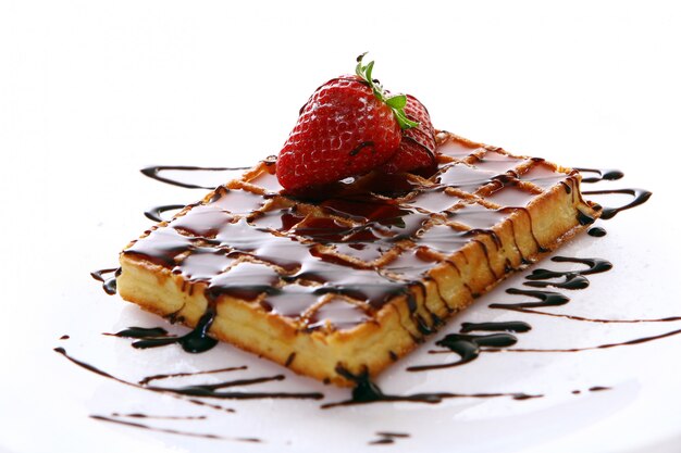 Fresh sweet chocolate waffles with strawberry