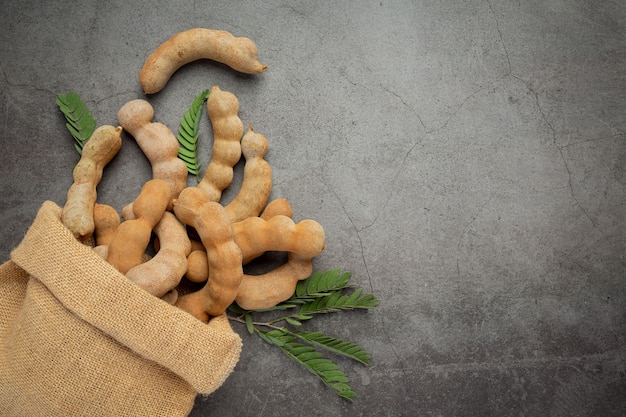 Free photo fresh sweet ripe tamarind on dark surface