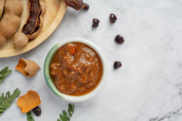 Free photo fresh sweet ripe tamarind on white surface