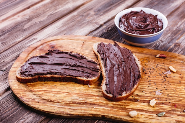 Fresh, tasty and healthy food. Lunch or breakfast ideas. Bread with chocolate butter lies 