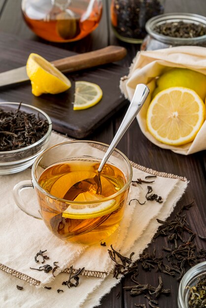 Fresh tea with lemon on table