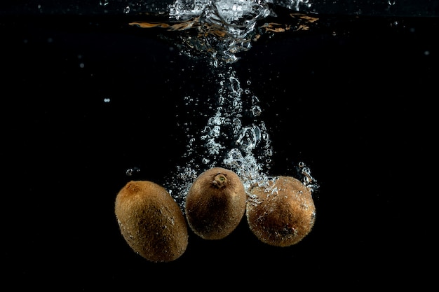 Fresh three kiwis in the water