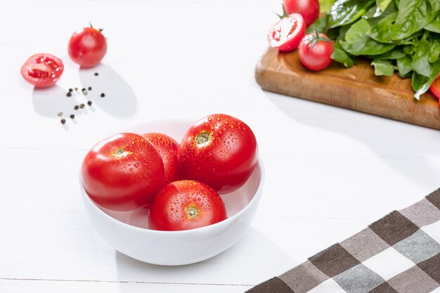 fresh tomatoes on bowl