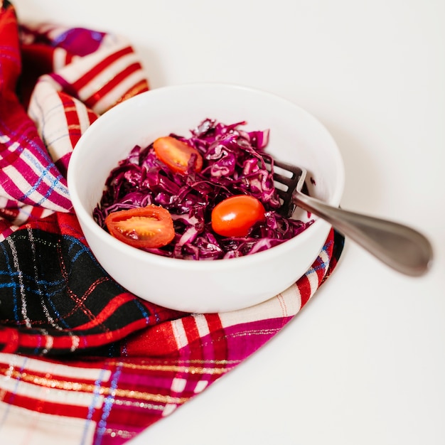 Fresh tomatoes and red cabbage in bowl
