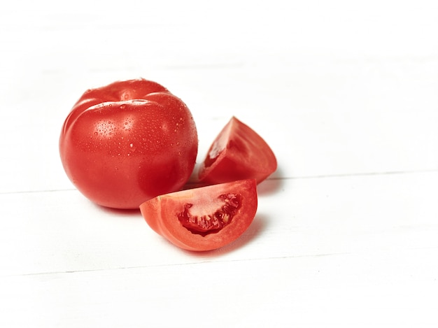 The fresh tomatoes on white