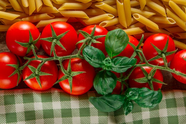 Fresh tomatoes with macaroni and tablecloth