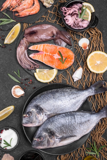 Fresh uncooked seafood fish in various plates