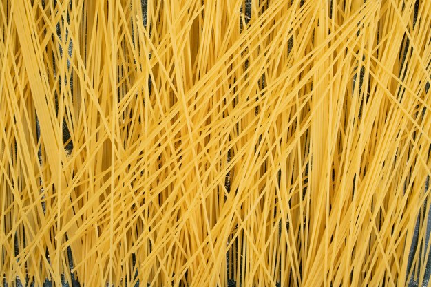 Fresh uncooked whole grain pasta . High quality photo