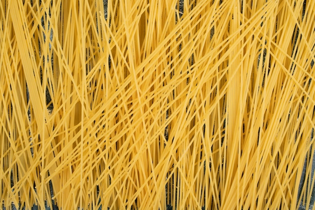 Fresh uncooked whole grain pasta . High quality photo