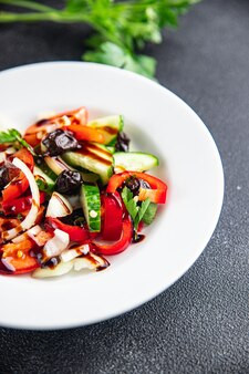 Fresh vegetable salad tomato cucumber pepper onion black olives pitted healthy meal food snack