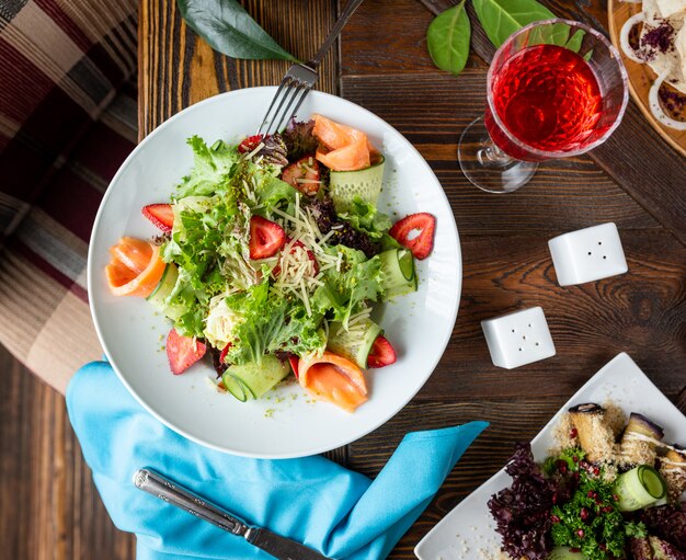 Fresh vegetable salad with salmon