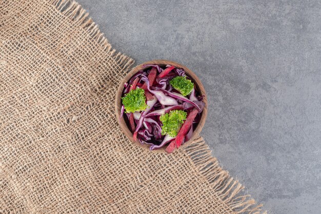 Fresh vegetable slices in wooden bowl. High quality photo