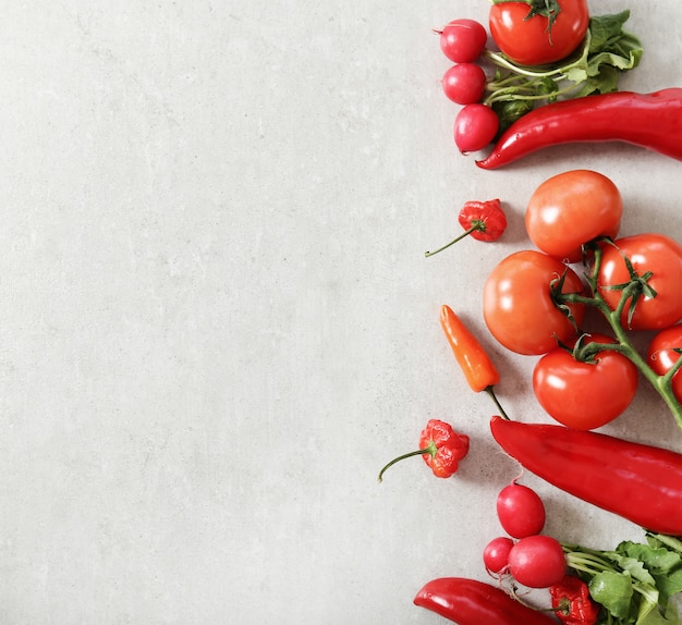 Fresh vegetables on gray surface