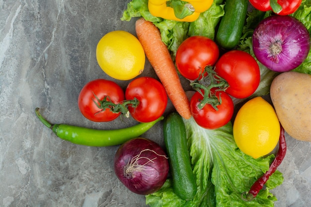 Free photo fresh vegetables on marble background. high quality photo