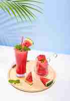 Free photo fresh watermelon juice or smoothie in glasses with watermelon pieces
